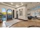 Grand foyer with high ceilings, marble floors, an ornate wrought-iron door, and art display at 9815 N Copper Ridge Trl, Fountain Hills, AZ 85268