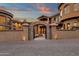 Elegant stone entrance with a gated archway leading to the home at 9815 N Copper Ridge Trl, Fountain Hills, AZ 85268