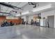 Oversized garage space with epoxy floors, storage cabinets, and room for multiple vehicles at 9815 N Copper Ridge Trl, Fountain Hills, AZ 85268