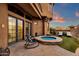 Relaxing backyard with a hot tub, lounge chairs, and manicured landscaping at 9815 N Copper Ridge Trl, Fountain Hills, AZ 85268
