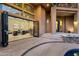 Open living room with glass doors to the backyard, leading to a pool and patio at 9815 N Copper Ridge Trl, Fountain Hills, AZ 85268