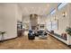 Bright living room with stone fireplace, comfortable seating, and a wet bar area at 9815 N Copper Ridge Trl, Fountain Hills, AZ 85268