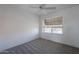 Spacious bedroom featuring ceiling fan and neutral wall colors at 10445 N 11Th Pl # 1, Phoenix, AZ 85020