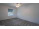 Simple bedroom with ceiling fan and neutral color scheme at 10445 N 11Th Pl # 1, Phoenix, AZ 85020