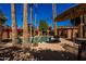 Inviting community pool area with palm trees and shaded seating at 10445 N 11Th Pl # 1, Phoenix, AZ 85020