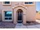 Inviting condo entry with decorative door and stone accents at 10445 N 11Th Pl # 1, Phoenix, AZ 85020