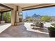 Outdoor patio with fireplace, seating area, and mountain views at 10585 E Crescent Moon Dr # 33, Scottsdale, AZ 85262