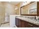 Bathroom with granite vanity, large mirror, and walk-in shower at 10585 E Crescent Moon Dr # 33, Scottsdale, AZ 85262