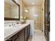 Bathroom with granite vanity, large mirror, and walk-in shower at 10585 E Crescent Moon Dr # 33, Scottsdale, AZ 85262