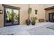 Private courtyard access with double doors and lush greenery at 10585 E Crescent Moon Dr # 33, Scottsdale, AZ 85262