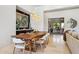 Elegant dining room featuring a long, wooden table and modern lighting at 10585 E Crescent Moon Dr # 33, Scottsdale, AZ 85262