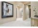 Elegant hallway with large artwork and tile flooring at 10585 E Crescent Moon Dr # 33, Scottsdale, AZ 85262