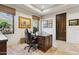 Elegant home office with hardwood floors and a large desk at 10585 E Crescent Moon Dr # 33, Scottsdale, AZ 85262