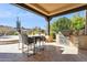 Outdoor kitchen with stainless steel appliances and seating area at 10585 E Crescent Moon Dr # 33, Scottsdale, AZ 85262