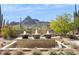 Three-tiered water feature with mountain backdrop at 10585 E Crescent Moon Dr # 33, Scottsdale, AZ 85262