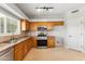 Kitchen with wood cabinets, granite countertops, and stainless steel appliances at 10765 N 119Th St, Scottsdale, AZ 85259