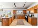 Kitchen with wood cabinets, granite countertops, and stainless steel appliances at 10765 N 119Th St, Scottsdale, AZ 85259