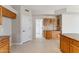 Kitchen with wood cabinets, granite countertops, and pantry at 10765 N 119Th St, Scottsdale, AZ 85259