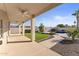 Covered patio overlooking the pool and grassy backyard at 10765 N 119Th St, Scottsdale, AZ 85259