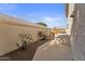 Side yard with gravel landscaping and gated access at 10765 N 119Th St, Scottsdale, AZ 85259