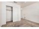 Bedroom with sliding door closet and neutral carpeting at 1085 W Dava Dr, Tempe, AZ 85283