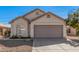 Single-story house with a two-car garage and desert landscaping at 1085 W Dava Dr, Tempe, AZ 85283