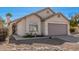 Tan colored house with a two-car garage and walkway at 1085 W Dava Dr, Tempe, AZ 85283