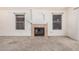 Bright living room with a fireplace and neutral carpeting at 1085 W Dava Dr, Tempe, AZ 85283