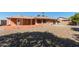 Large backyard with gravel and fruit trees at 11029 W Meade Dr, Sun City, AZ 85351