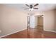 Bedroom with mirrored closet doors and laminate flooring at 11029 W Meade Dr, Sun City, AZ 85351