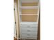 White custom closet with shelves and drawers at 11029 W Meade Dr, Sun City, AZ 85351