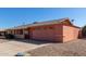 Single story home with peach stucco exterior, two-car garage, and desert landscaping at 11029 W Meade Dr, Sun City, AZ 85351