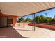 Covered patio with tile flooring and fruit trees at 11029 W Meade Dr, Sun City, AZ 85351