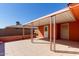 Covered patio with tile flooring and storage at 11029 W Meade Dr, Sun City, AZ 85351