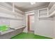 Storage room with shelves and work surface at 11029 W Meade Dr, Sun City, AZ 85351