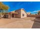 Backyard with flagstone patio and access from the home at 11465 W Virginia Ave, Avondale, AZ 85392