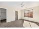 Bright bedroom with ceiling fan and large window at 11465 W Virginia Ave, Avondale, AZ 85392