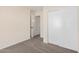 Well-lit bedroom featuring a large closet and neutral carpeting at 11465 W Virginia Ave, Avondale, AZ 85392