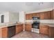 Spacious kitchen with stainless steel appliances and light wood cabinets at 11465 W Virginia Ave, Avondale, AZ 85392