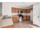 Modern kitchen with stainless steel appliances and wood cabinets at 11465 W Virginia Ave, Avondale, AZ 85392