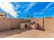 Built-in BBQ and flagstone patio in backyard at 11465 W Virginia Ave, Avondale, AZ 85392