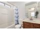 Bathroom with tub, shower, and wood vanity at 1151 E Stardust Way, San Tan Valley, AZ 85143