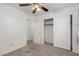 Bedroom with ceiling fan, carpet, and access to bathroom at 1151 E Stardust Way, San Tan Valley, AZ 85143