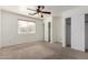 Bedroom with ceiling fan, carpet flooring, and large closet at 1151 E Stardust Way, San Tan Valley, AZ 85143