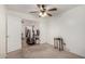 Bedroom with ceiling fan, carpet, and double door closet at 1151 E Stardust Way, San Tan Valley, AZ 85143