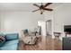 Bright living room with hardwood floors and comfy seating at 1151 E Stardust Way, San Tan Valley, AZ 85143