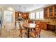 Kitchen breakfast nook with wood table and chairs, adjacent to kitchen at 1188 W Laredo Ave, Gilbert, AZ 85233