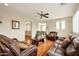 Living room with hardwood floors, ceiling fan and comfortable seating at 1188 W Laredo Ave, Gilbert, AZ 85233