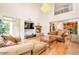 Living room with hardwood floors, fireplace and high ceilings at 1188 W Laredo Ave, Gilbert, AZ 85233