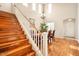 Elegant staircase with hardwood floors and white railing at 1188 W Laredo Ave, Gilbert, AZ 85233